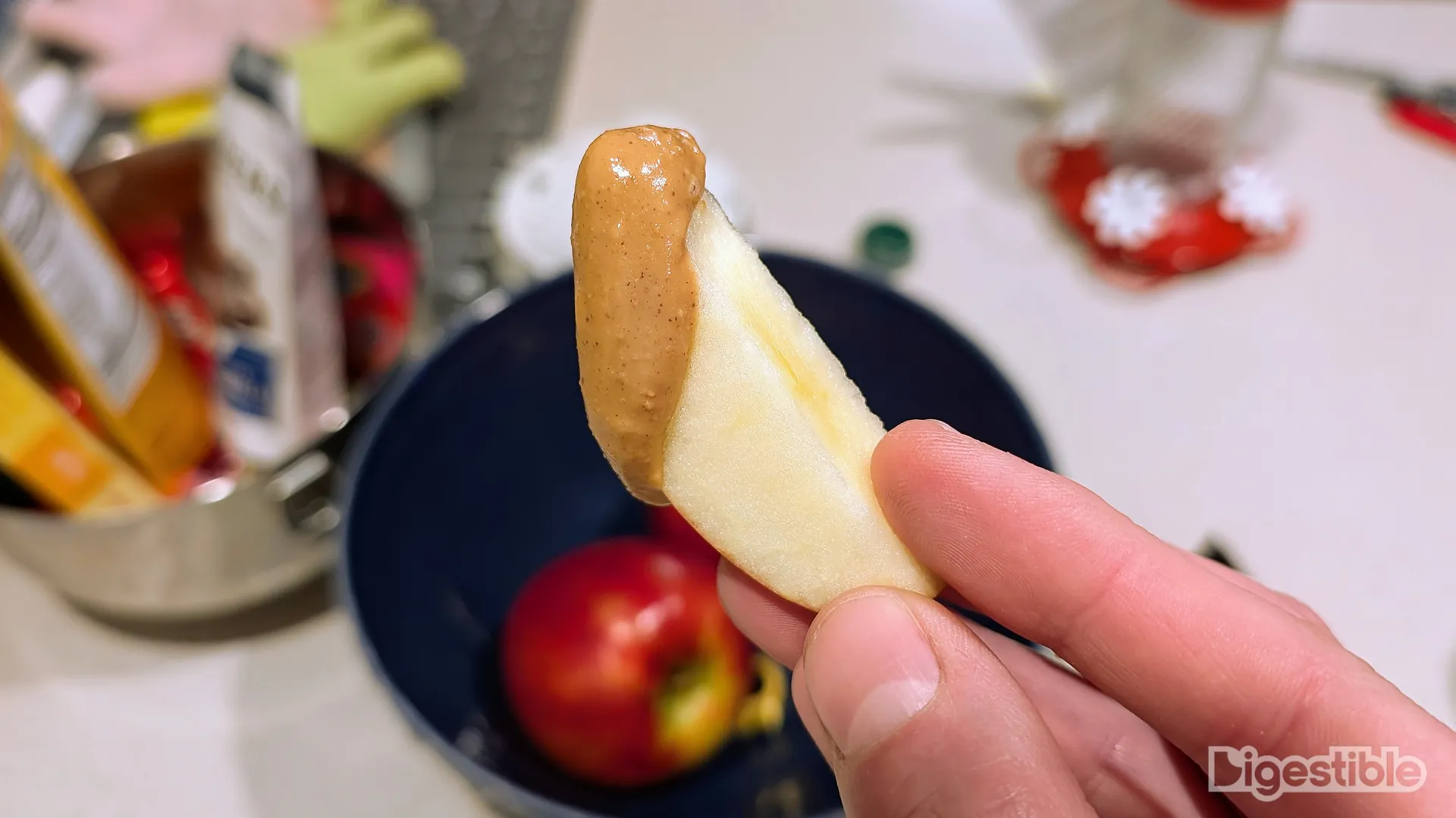 Wild Twist apple slice dipped in peanut butter.