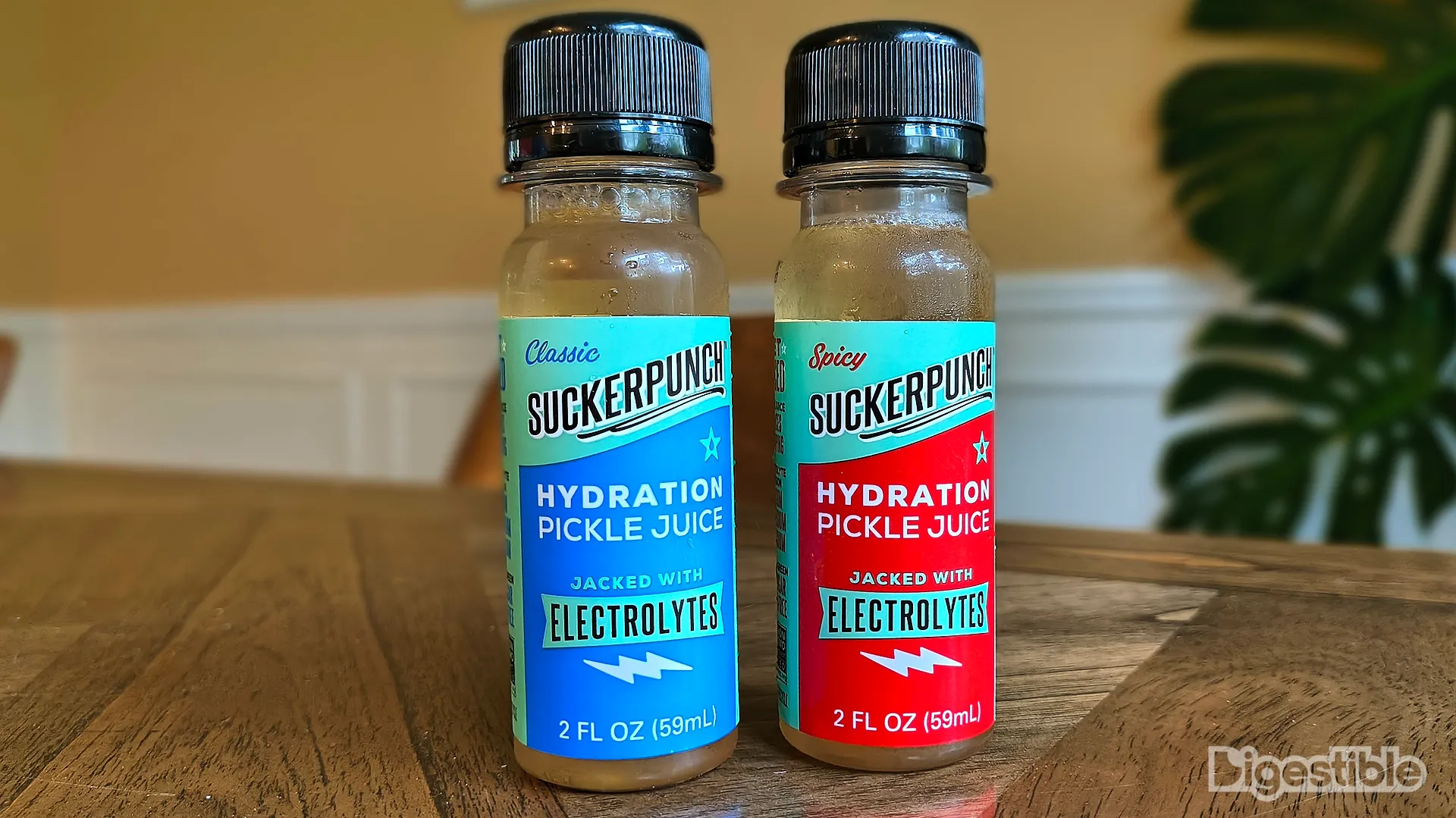 Two bottles of pickle juice shooters.