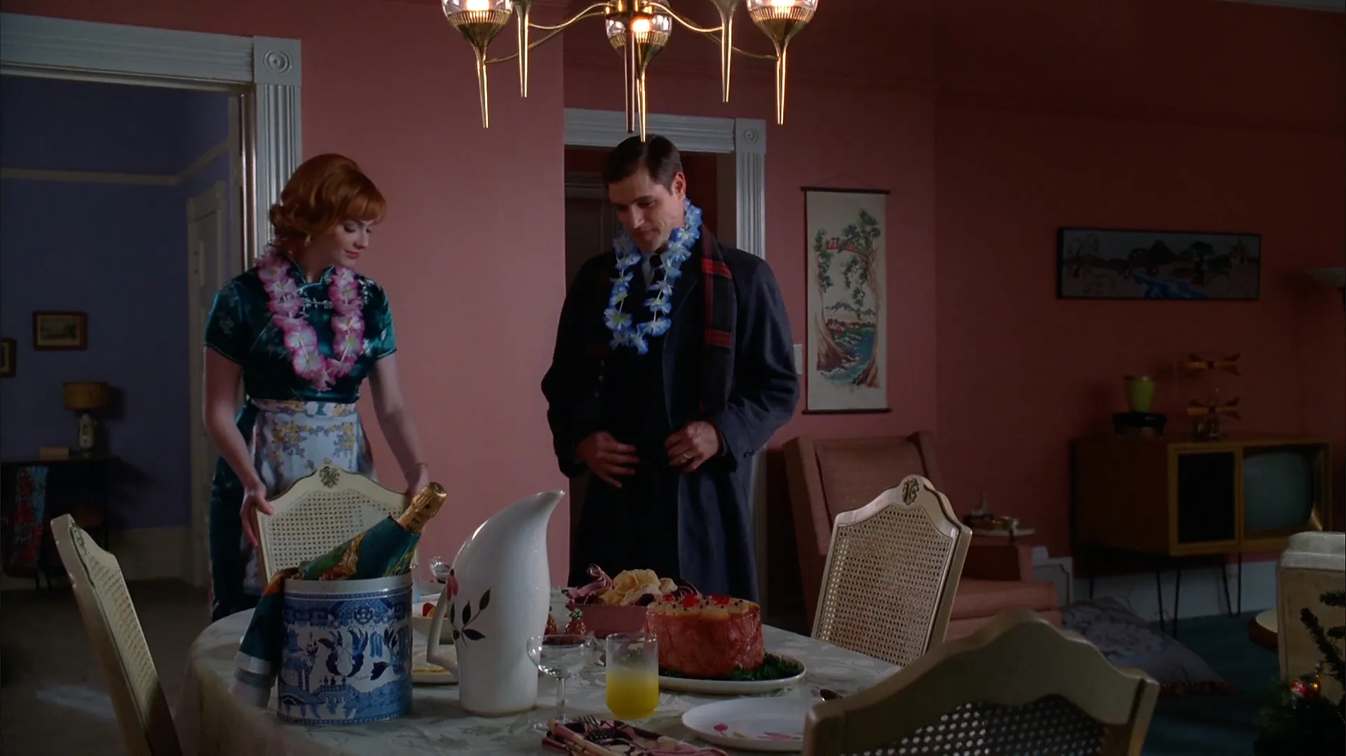 Pineapple glazed ham and orange juice served on a table.