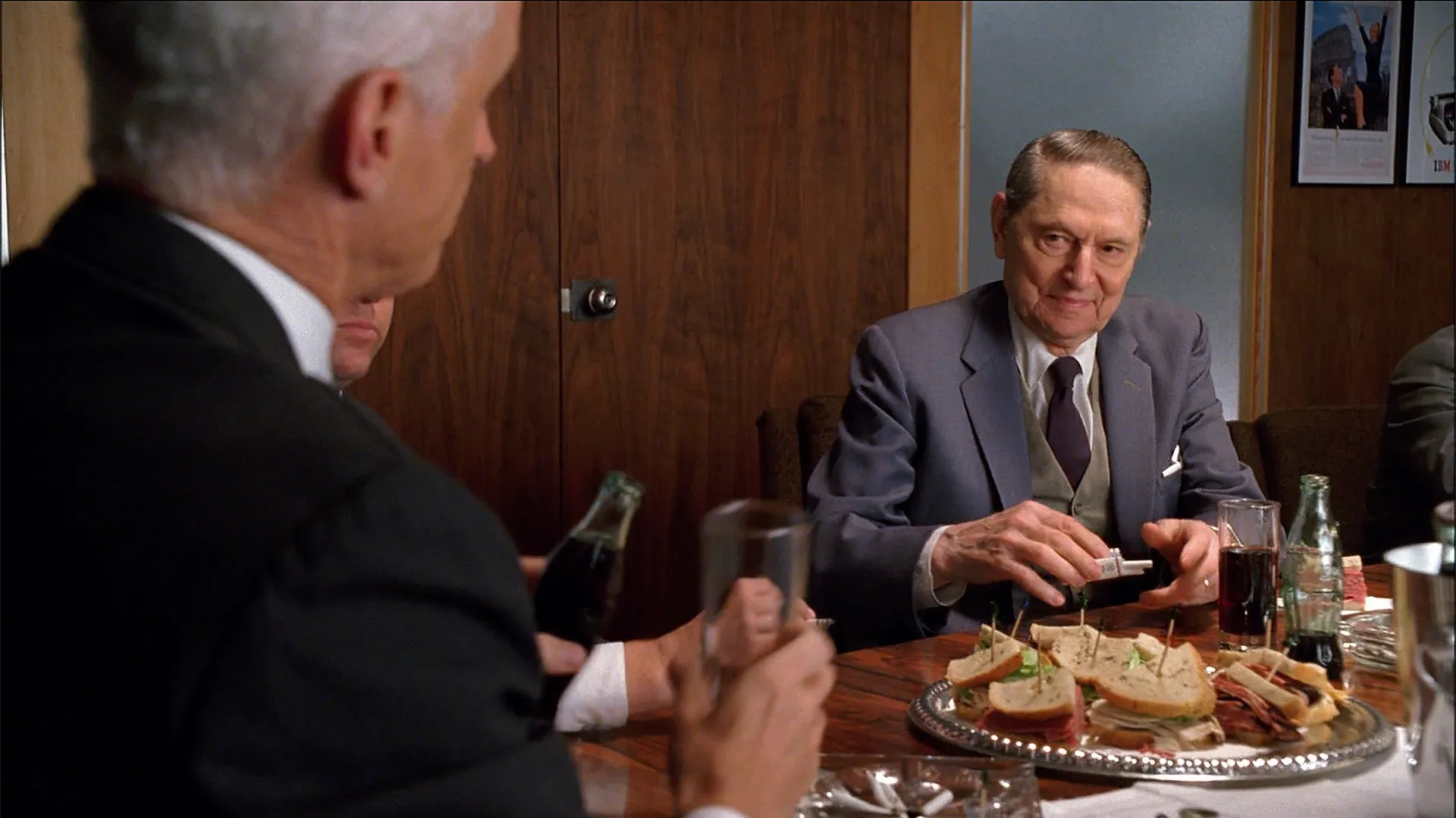 Roger meeting with Lucky's and eating from a deli plate.