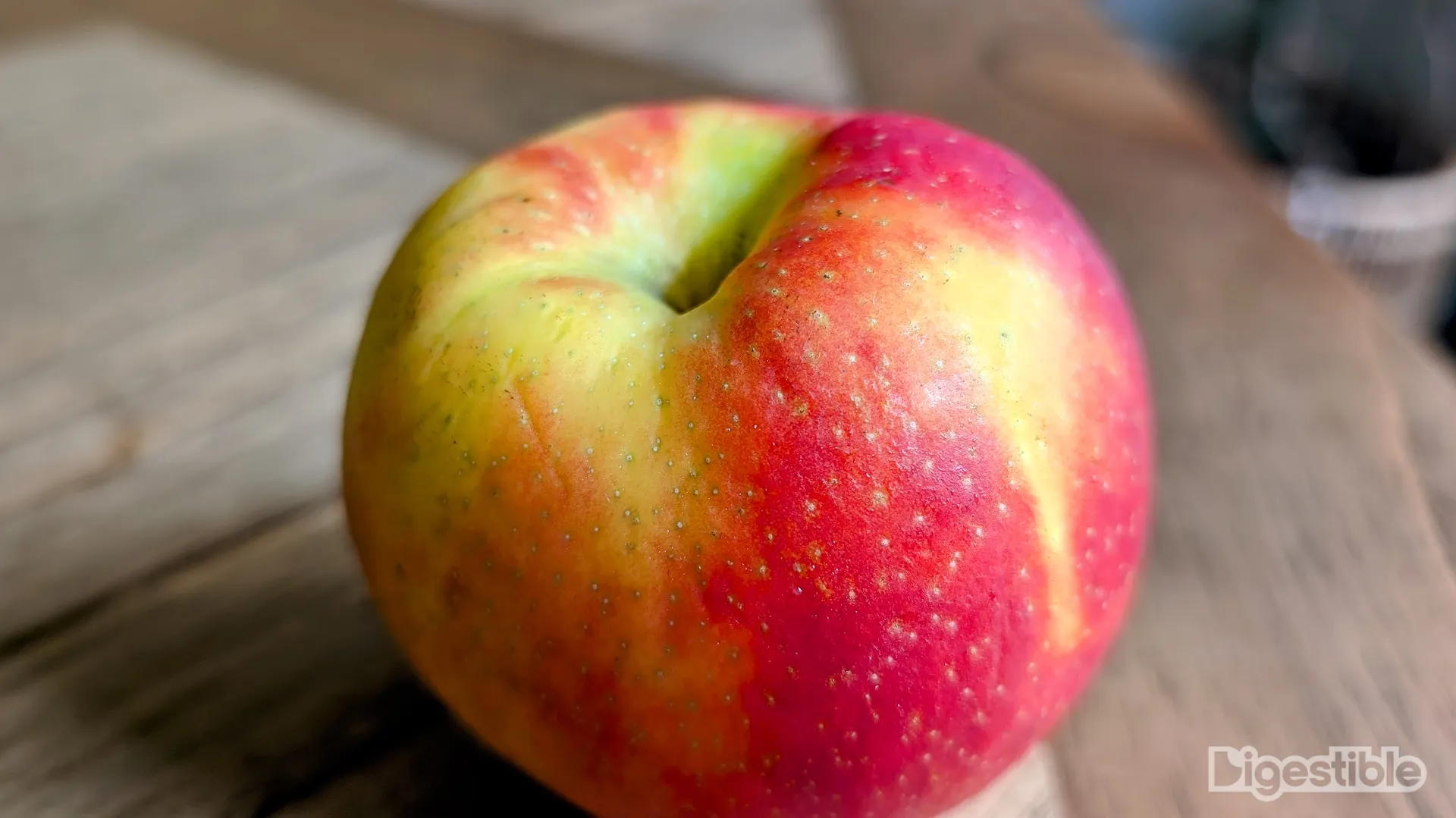 Top of a red and yellow apple.
