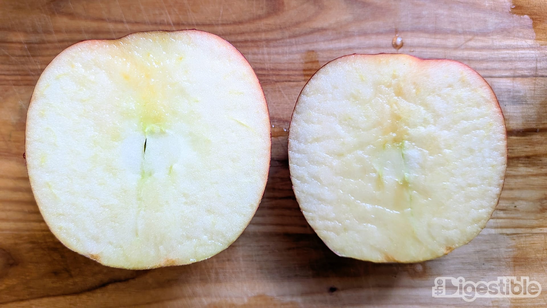 A Rave apple sliced in half, but not through the core.