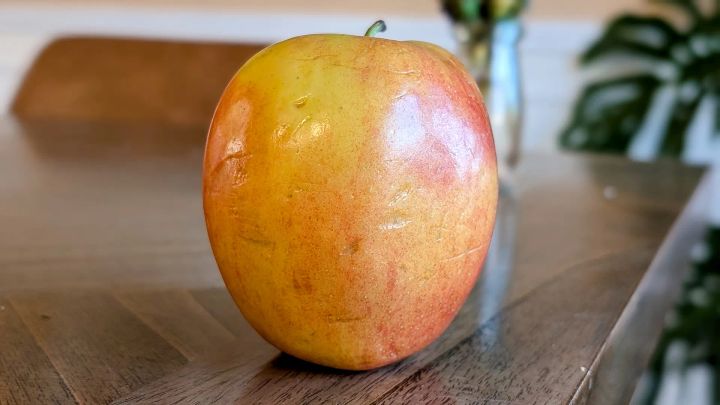 Jazz Apple on a brown table.