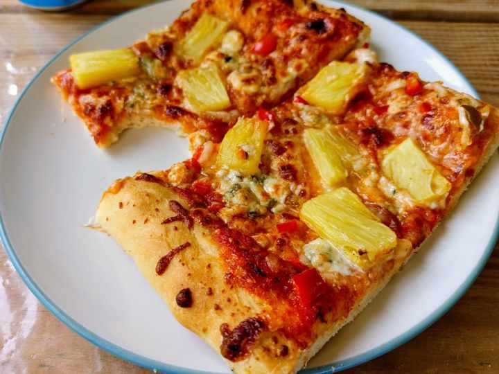 Pineapple and blue cheese on pizza.