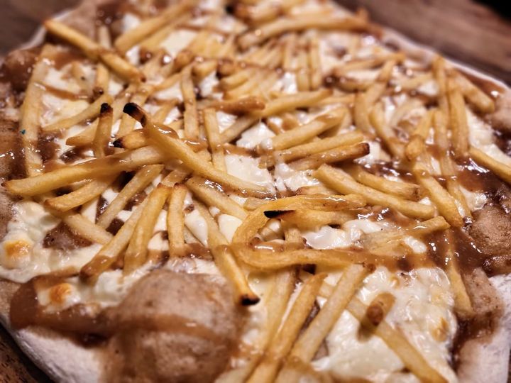 French fries and cheese curbs on pizza.