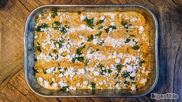 Thai Green Curry Enchiladas in a metal casserole dish.