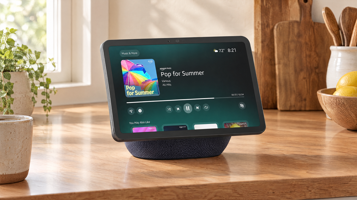 Amazon Echo Show 11 in Graphite on a wooden kitchen counter displaying music controls