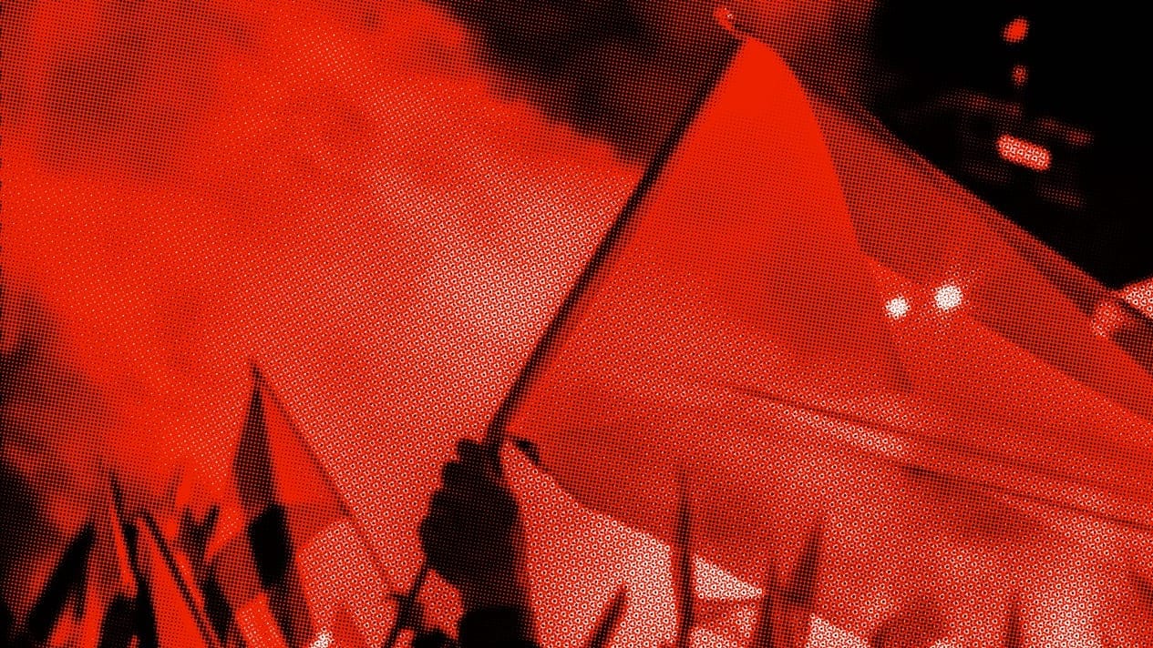 A red halftone photo of a protest. A hand holds a red flag.