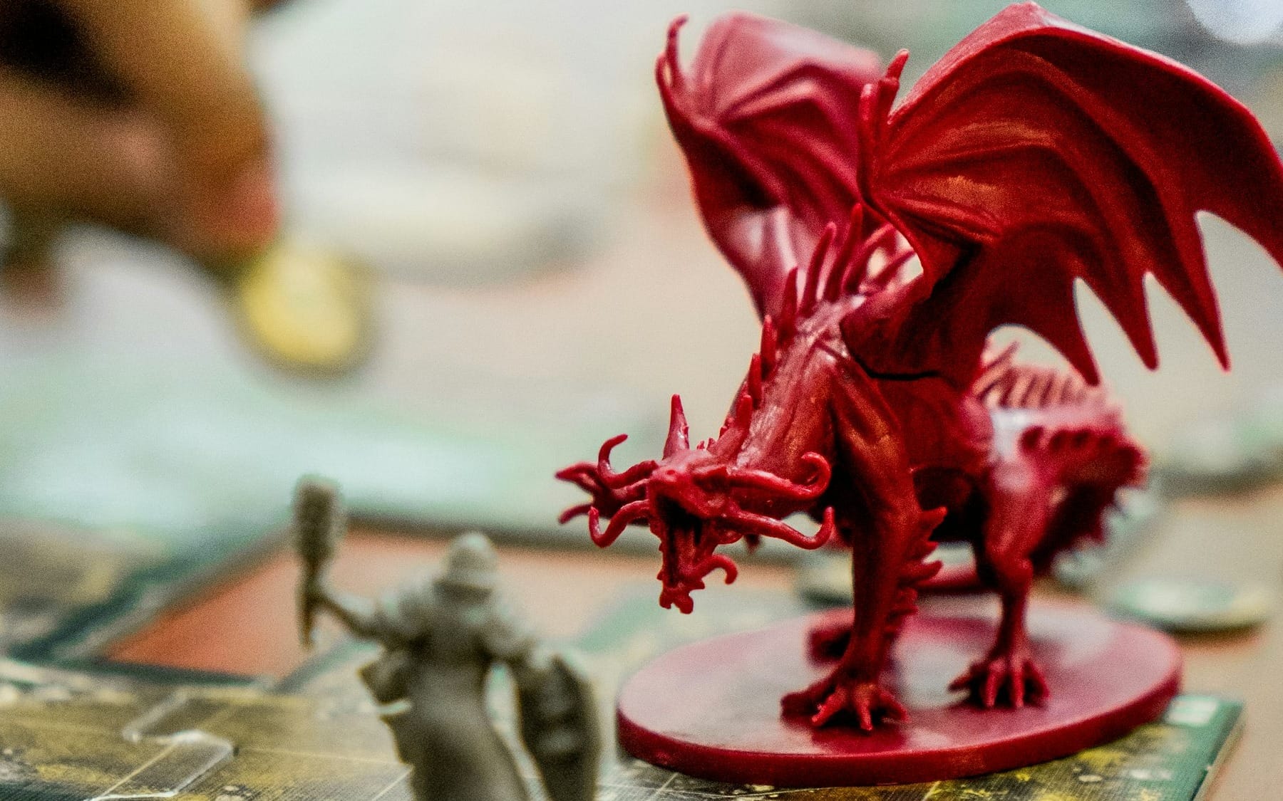 red dragon action figure on table