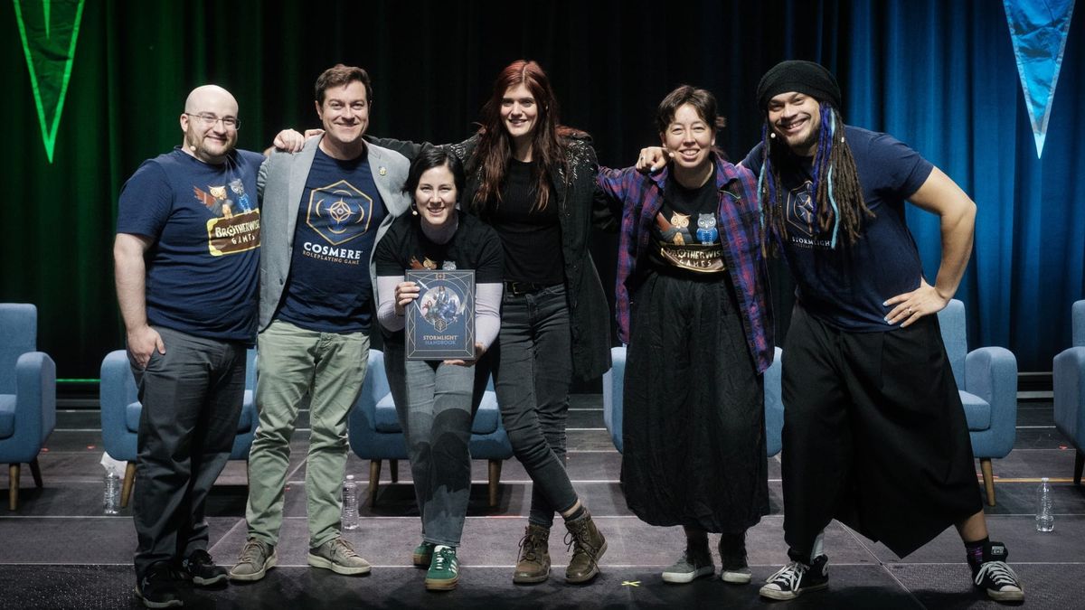 A photo of six members of the Brotherwise team on stage.