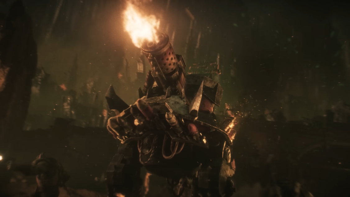 A still from a CGI animation of a big bipedal walker crudely constructed from scrap metal.