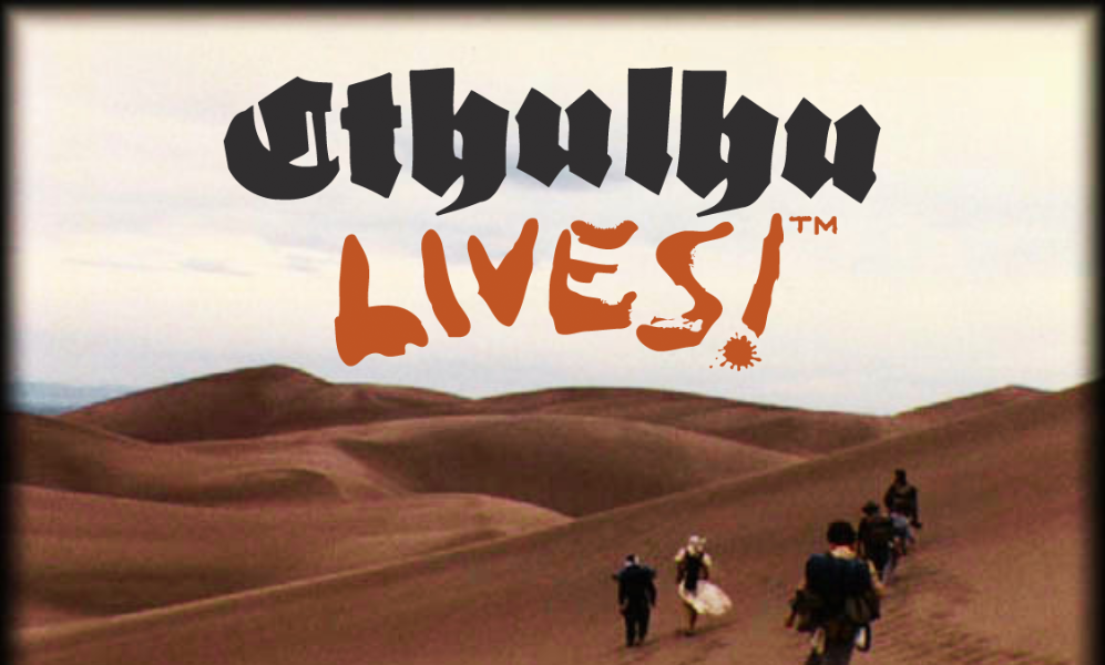 a desert landscape with some travellers walking the dunes, above them "Cthulhu Lives!" in big letters