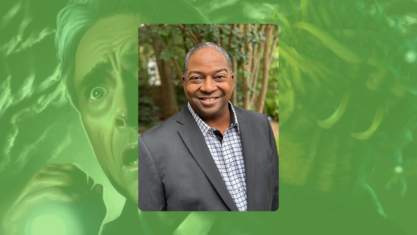 Headshot of Chris Spivey in a blazer and collared shirt. Background is key art from Delta Green, scared man and monster with green filter over it.