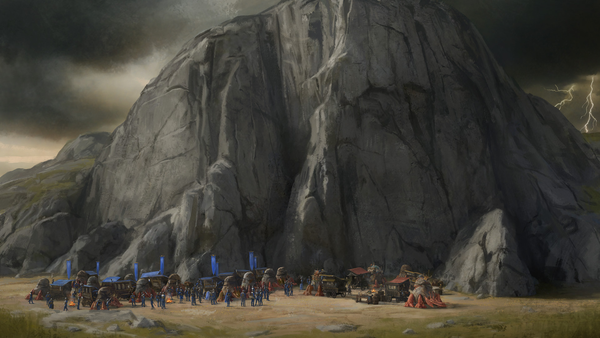 Two caravans take shelter in front of a massive rock face while a storm builds in the background.