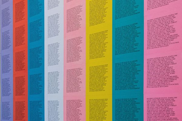 a colorful panel of repeating quotes stuck on a wall