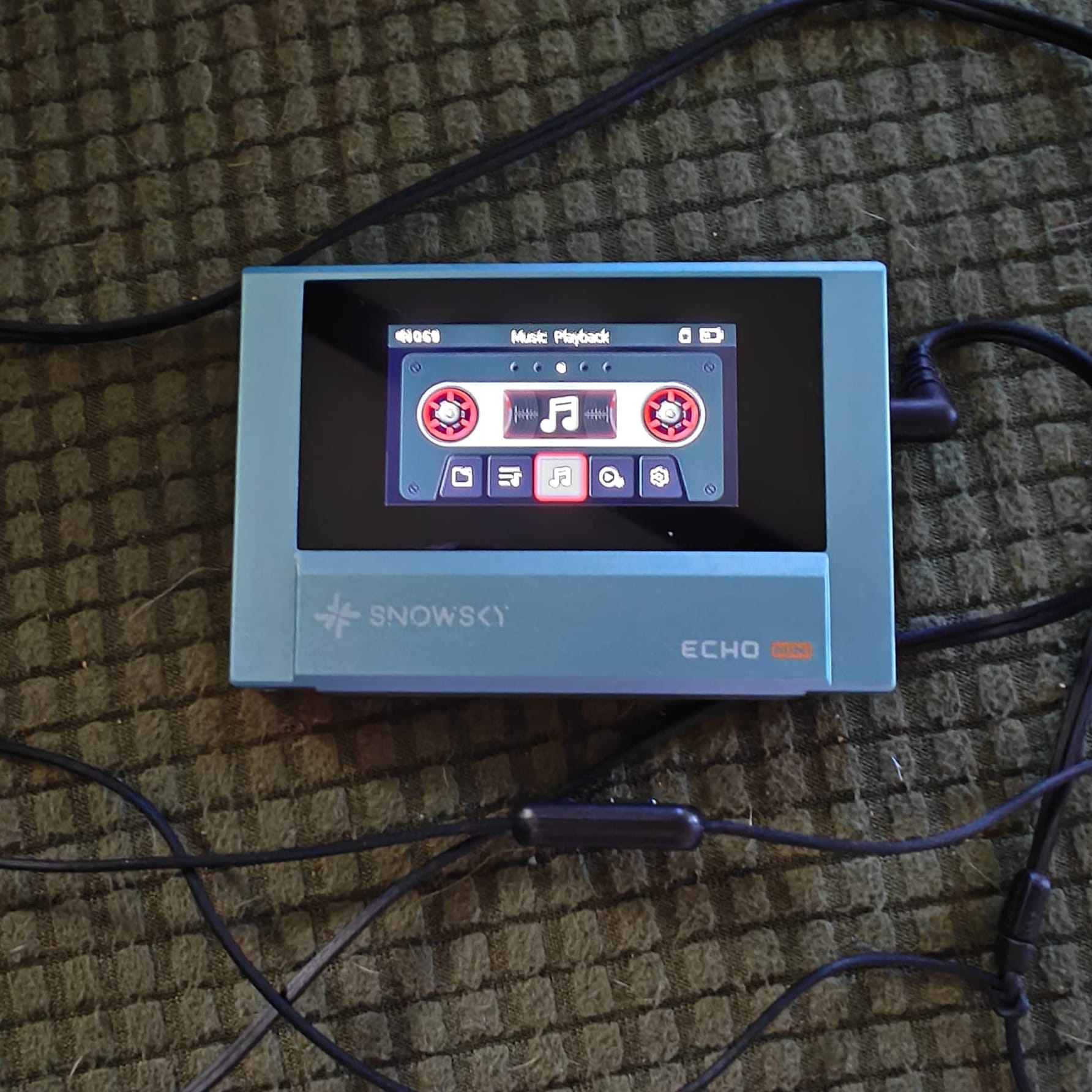 Snowsky Echo Mini music player with a digital display reading Music Playback