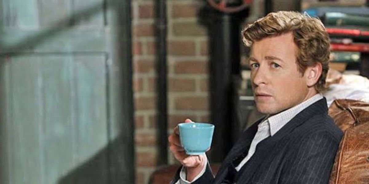 Simon Baker as Patrick Jane in The Mentalist, holding a blue cup of tea