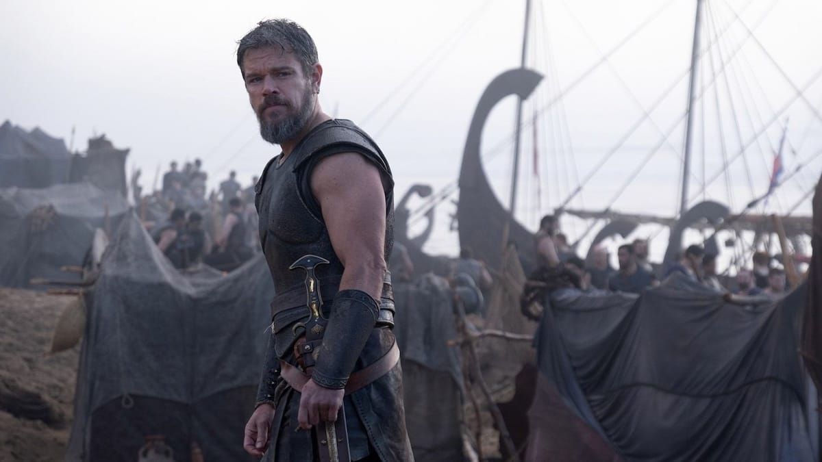 Matt Damon looking troubled as Odysseus on the beach at Troy