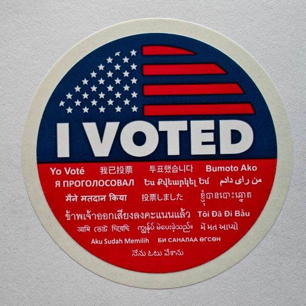 LA County voting sticker reading "I VOTED" in multiple languages