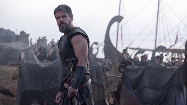 Matt Damon looking troubled as Odysseus on the beach at Troy