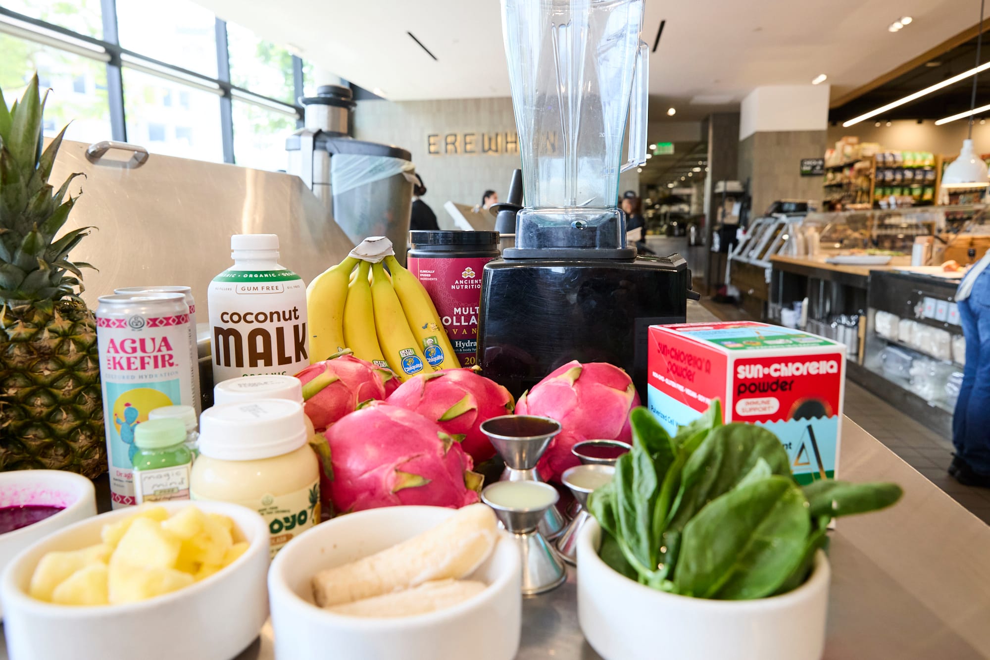 Smoothie ingredients in front of blender in Erewhon grocery store
