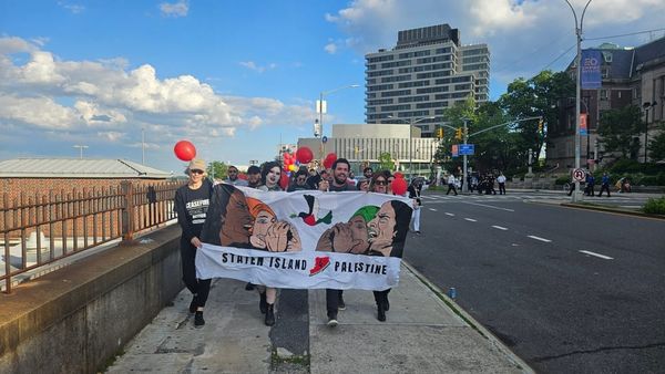 Activists March from Borough Hall to FerryHawks Stadium