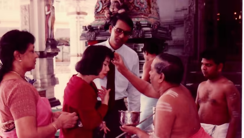 Tharman Shanmugaratnam and Jane Ittogi at their wedding ceremony in 1990 at a Hindu temple in Singapore. Mrs. Sarvambikai Shanmugaratnam is at far left.