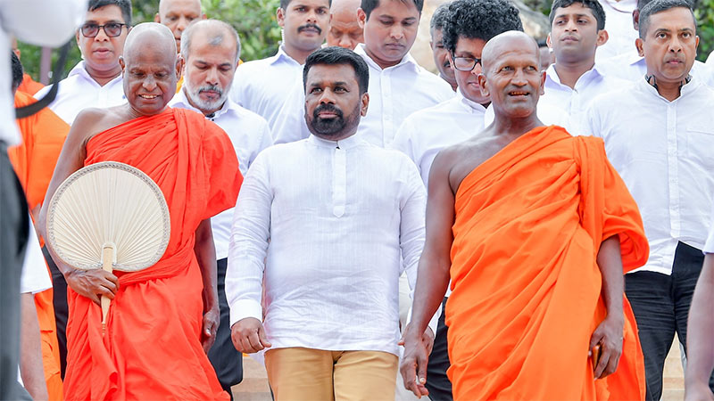 Ven. Pallegama Hemarathana Thera, left, the Chief Incumbent of the Atamasthana, with President Anura Kumara Dissanayake at a religious function in Anuradhapura last year.