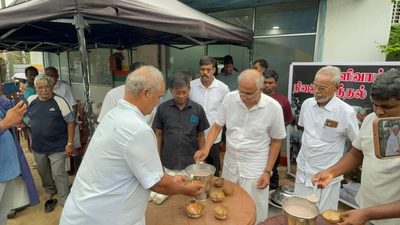M.A. Sumanthiran distributes symbolic Mullivaikkal Kanji during a remembrance event in Point Pedro