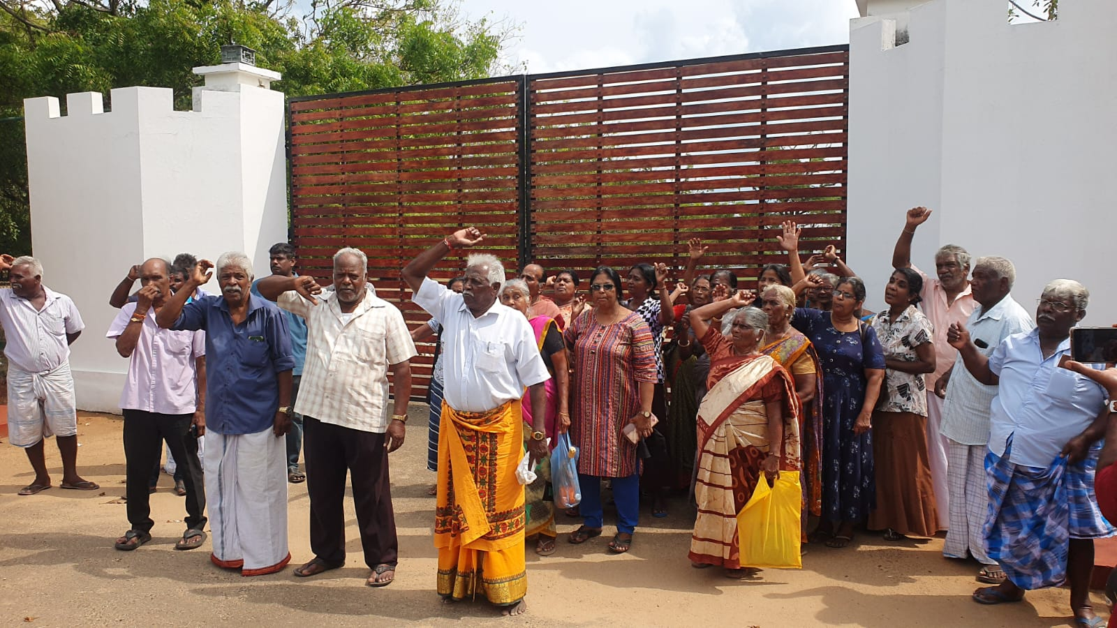 Displaced Tamil landowners protest outside the gates of the military’s Commando bungalow in Valikamam North, built on land taken from local Tamil families, as they demand the return of ancestral properties they have been denied access to for nearly 36 years.