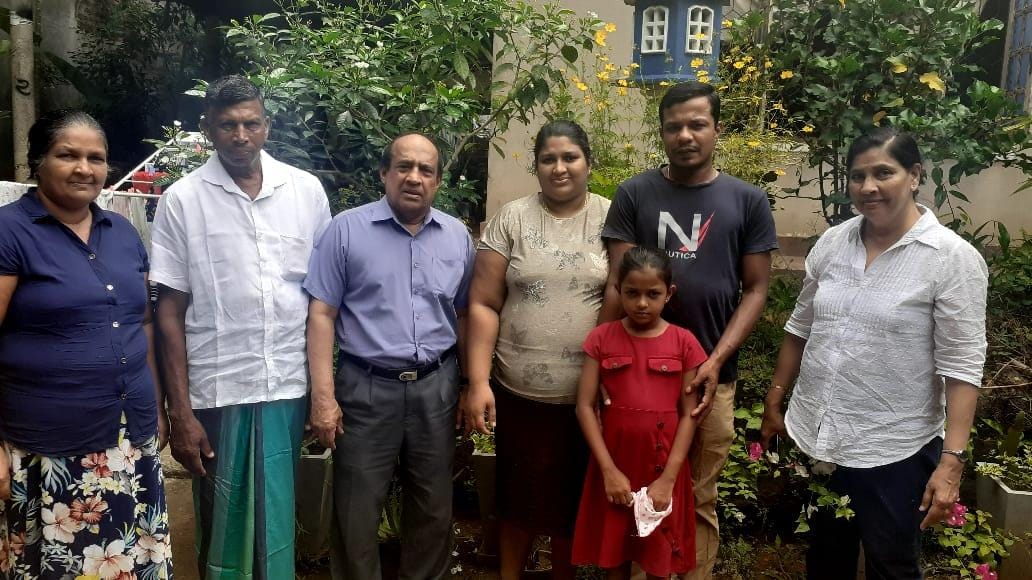 Ten years later, the surgeon Gamini Goonetilleke and his wife with Mali and her family.