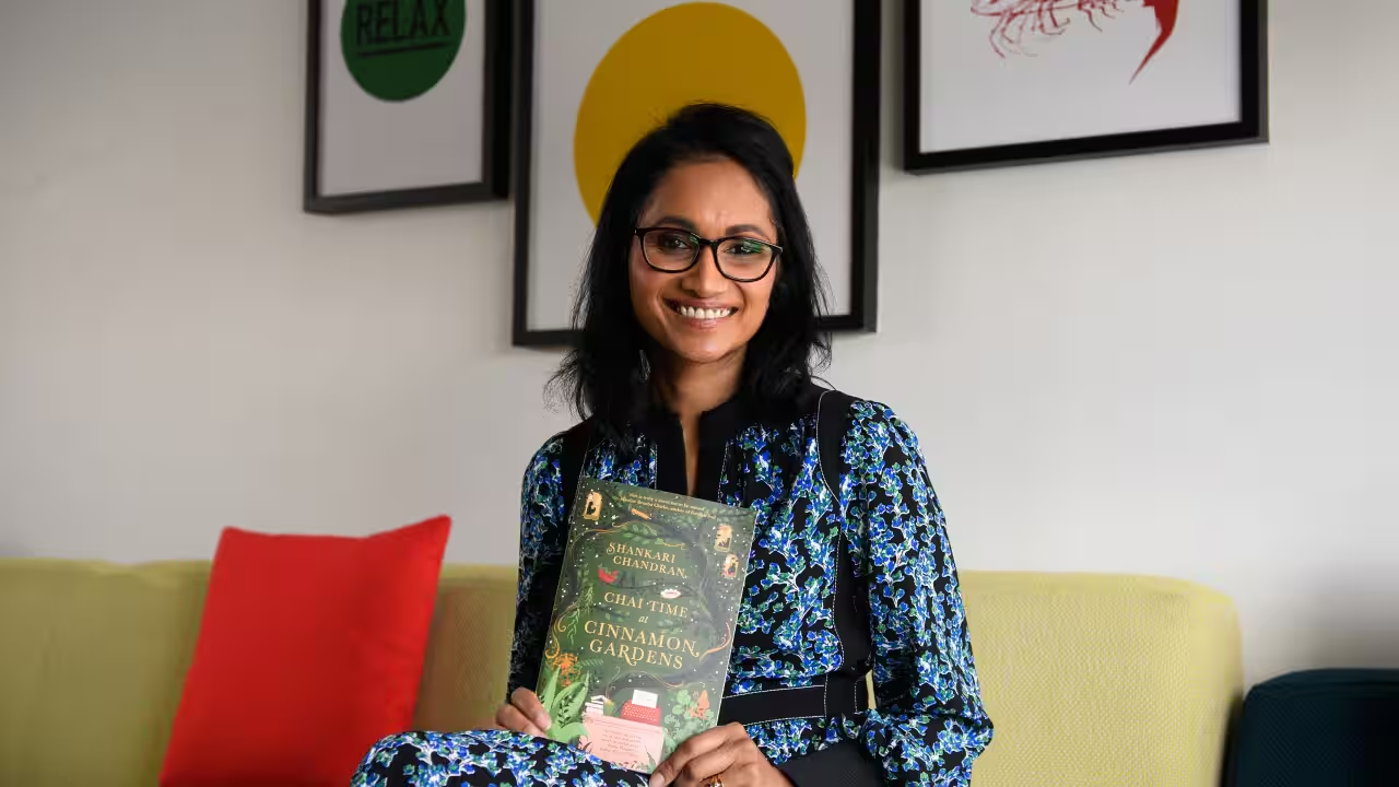 Shankari Chandran with her award-winning novel, Chai Time at Cinnamon Gardens, which won the 2023 Miles Franklin Literary Award, Australia’s highest literary honour.