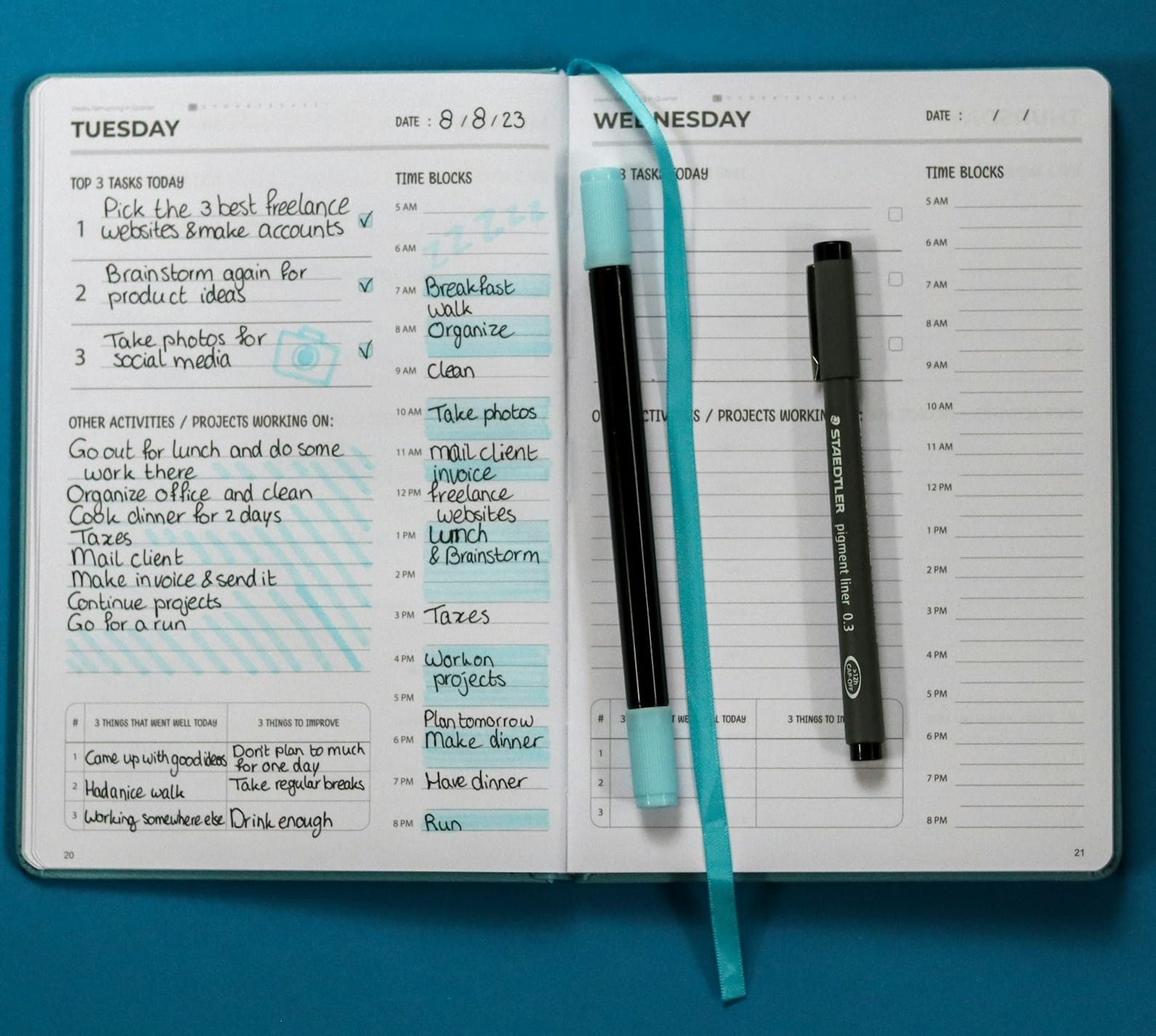 a notepad with a pen on top of it