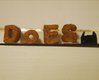 An experiment with sugar which has been sintered by DoES Liverpool's Laserscript machine to make their logo