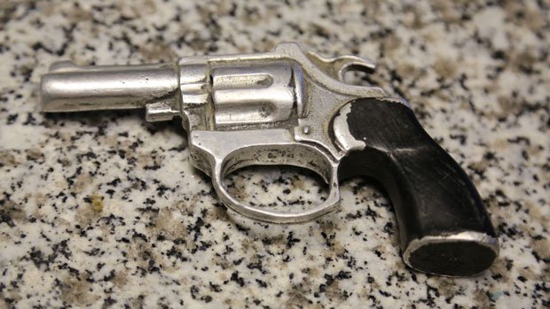 Metal gun cast from a toy water pistol