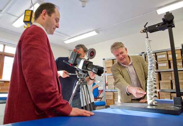 Gary Johnstone of Darlow Smithson Productions  filming Piers Mitchell and Bruno Morgan discussing the 3D model of Richard III’s  spine