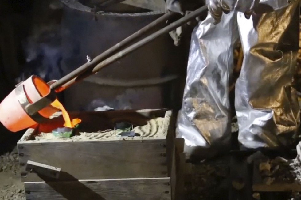 After melting a crucible full of aluminium (with some added copper), skimming the dross, it is time to pour.