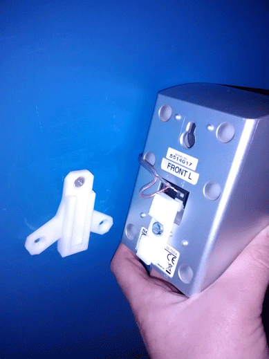 The bracket attaches easily to wall and speaker