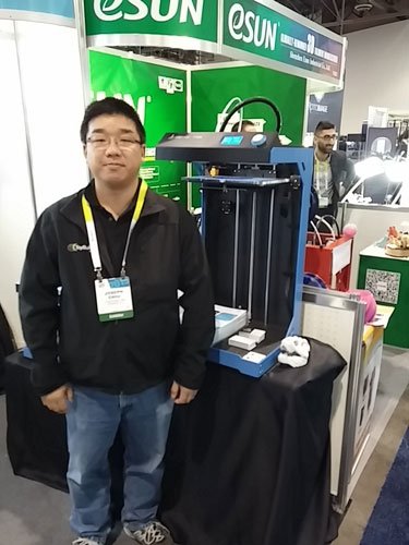 ToyBuilder Labs Co-Founder joseph Chiu next to the large ideaPrinter F100L