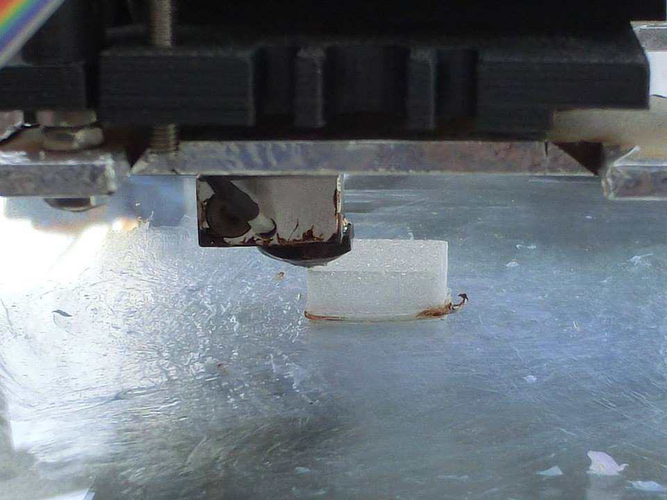 The RepRap printer on the front of the Mobile Fab at work