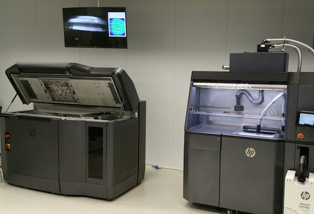 The MJF and post-processing station side-by-side.jpg