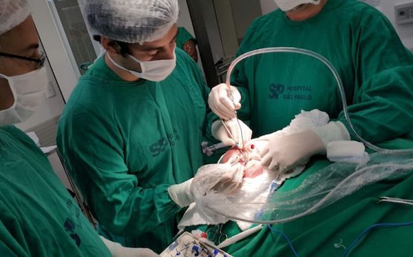 Surgeons operate on cancer patient