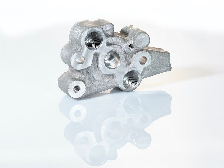 Nissan component produced with SPEE3D metal 3D printing technology. - SPEE3D