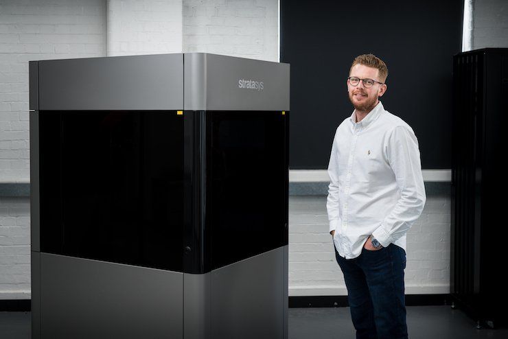 Philip Martin, Director at Ogle Models and Prototypes and the Stratasys Neo450s machine. - Ogle Models and Prototypes