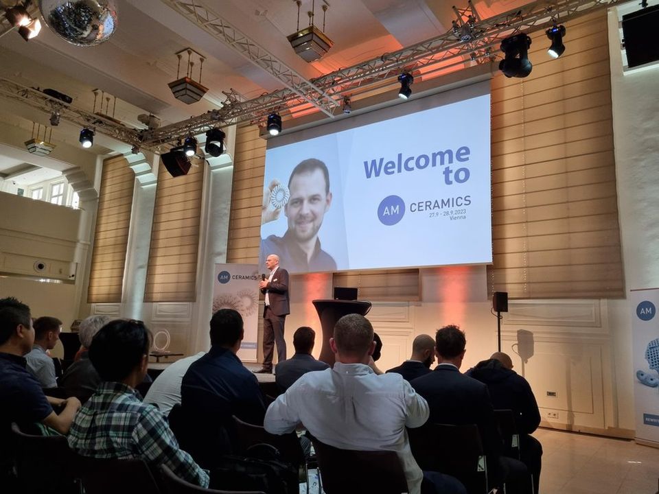 Lithoz CEO Johannes Homa opens the 2023 AM Ceramics Conference in Vienna. - TCT Magazine