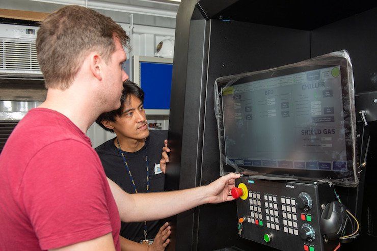 Diagnostics      PEARL HARBOR (July 9, 2022) Dan Porter, a Xerox technician, left and Andrew Wong, right, Emergency Ship Salvage Material (ESSM), conduct diagnostics on a 3D printer