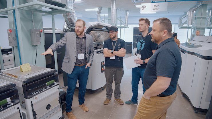 A3D Manufacturing Director of Manufacturing Taylor Moore presents the HP 3D printer build unit to guests. - A3D Manufacturing
