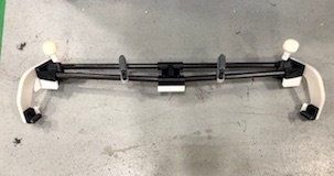 A Xometry-manufactured fixture used for alignment of the vehicle back end during assembly processes. - Xometry