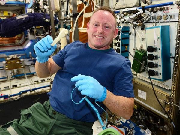 Butch Wilmore with Ratchet      Here is Butch with the ratchet printed on the Zero G Printer - Made In Space