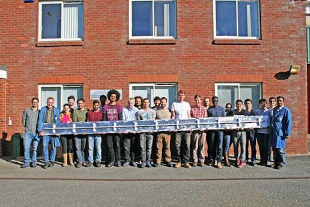 Cranfield Uni Biggest 3D printed part      Cranfield University students pose with the six-metre-long spar, which they believe to be the largest single 3D printed part to date. - Cranfield...